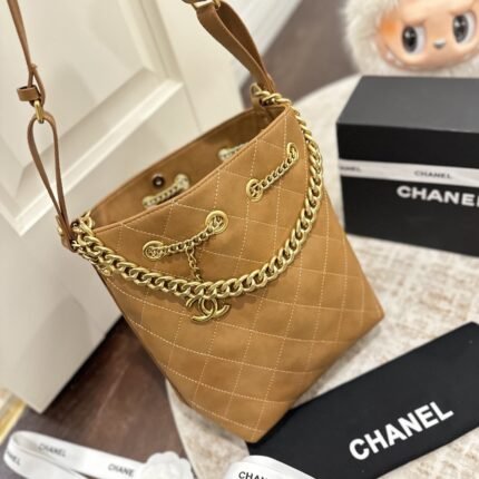 Chanel bucket bag and playful leather bag paired with vintage Chanel bag chain